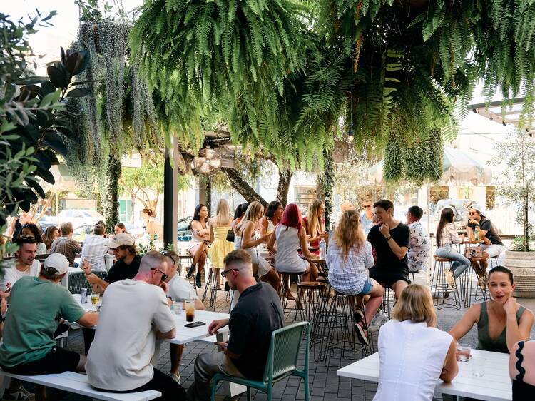 Outdoor beer garden filled with people