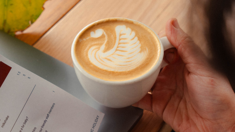 Cup of coffee with swan latte art