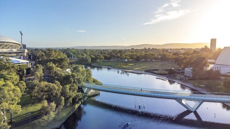 Take a leisurely bike ride along the River Torrens to West Beach