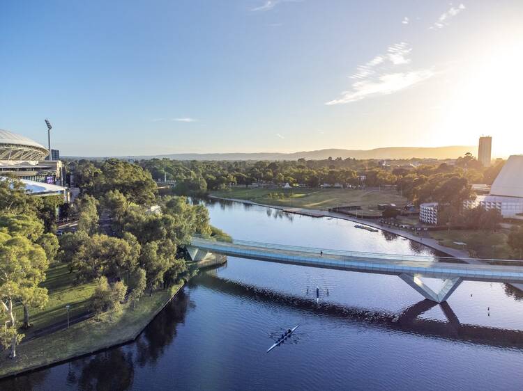 Take a leisurely bike ride along the River Torrens to West Beach