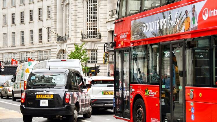 Traffic congestion in London with a black cab and a red bus