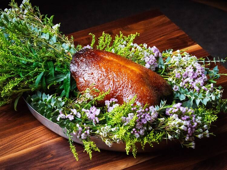 Dry aged duck surrounded by flowers