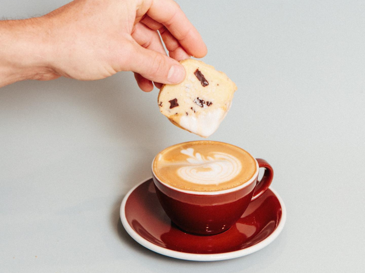 Shortbread being dunked into coffee