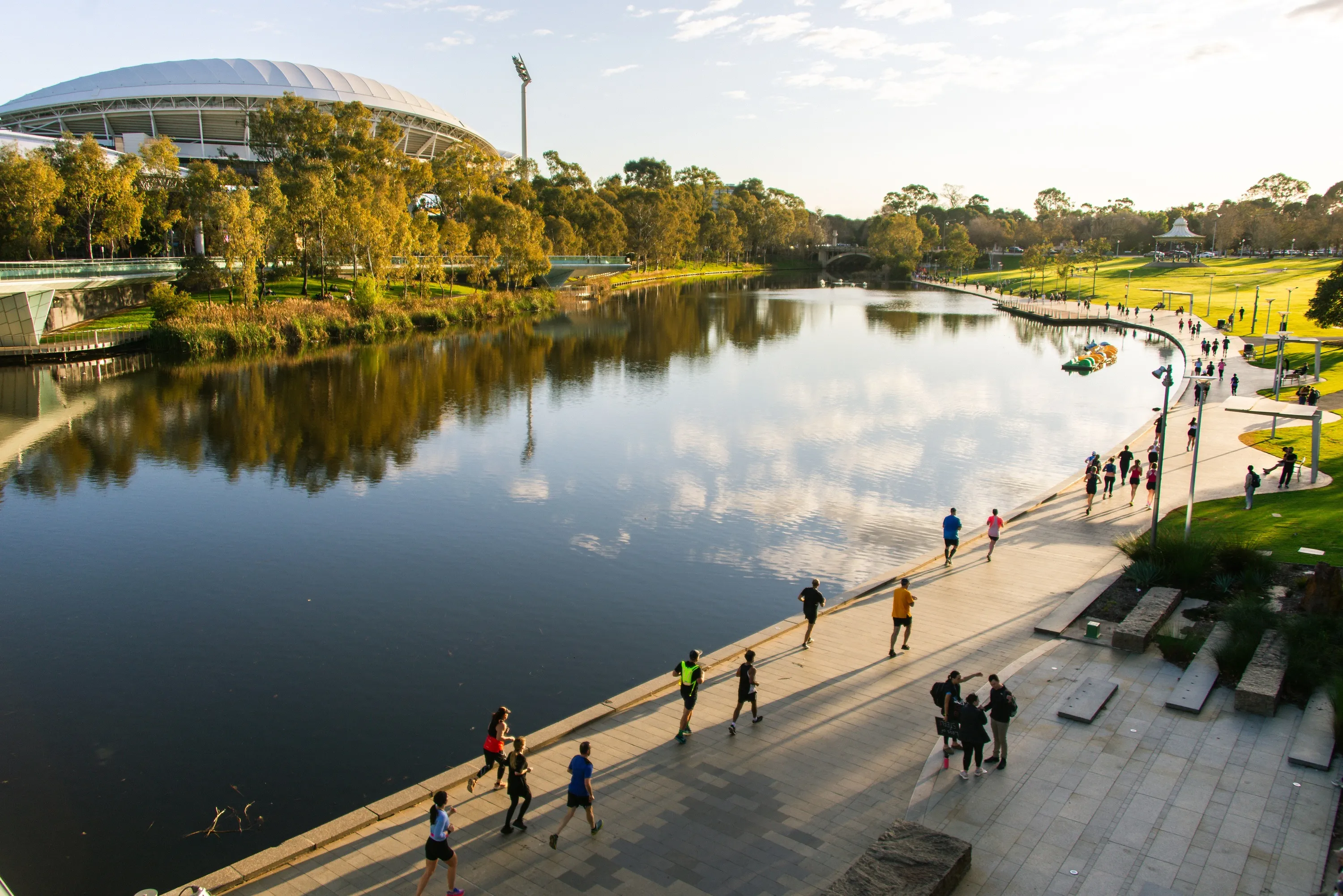 Marathon runners running around lake