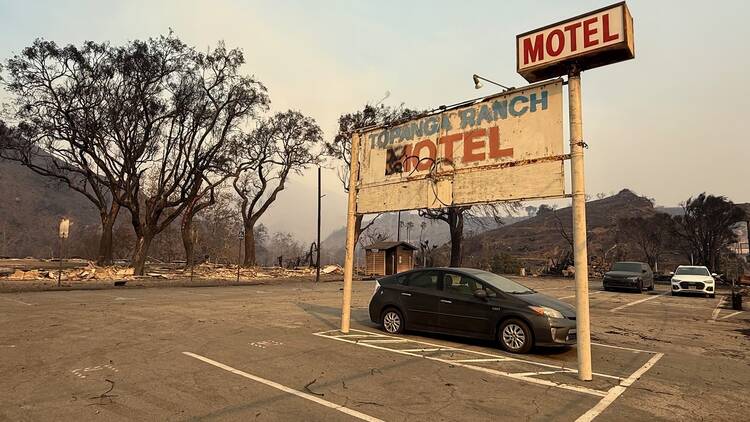 The fire-damaged sign for the Topanga Ranch Motel