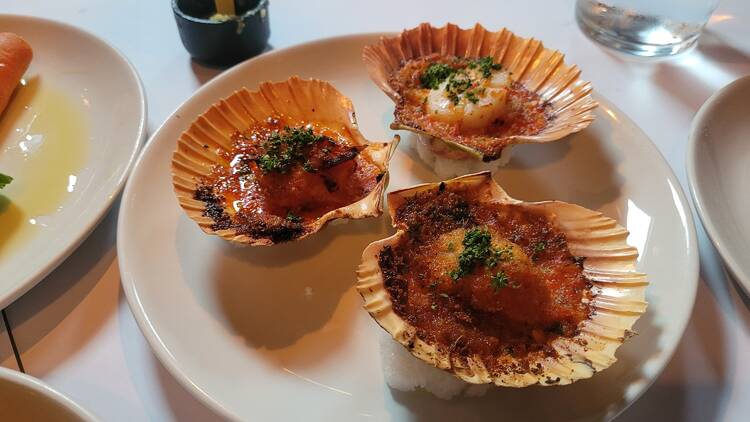 Three scallops on a plate