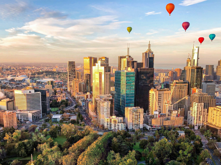 Hot air balloons flying over Melbourne city