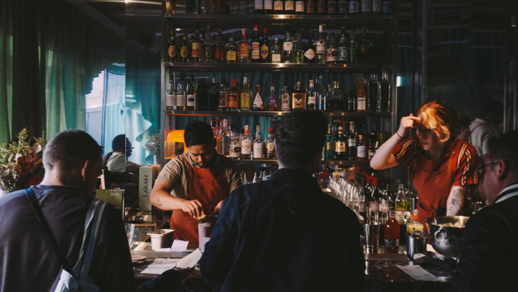 Inuman's staff working behind the bar.