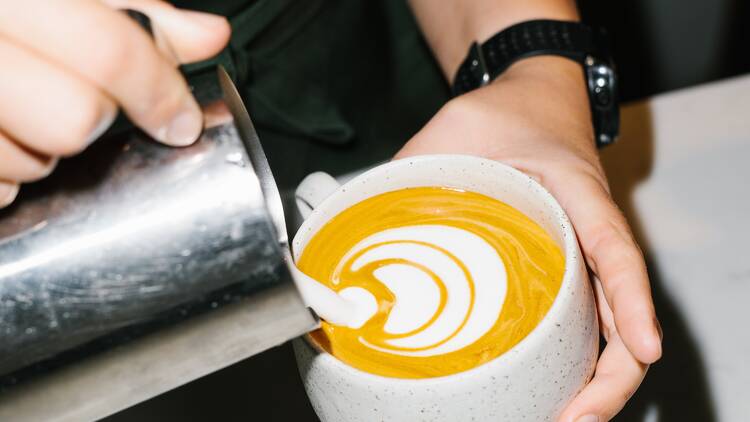 Coffee being poured into mug