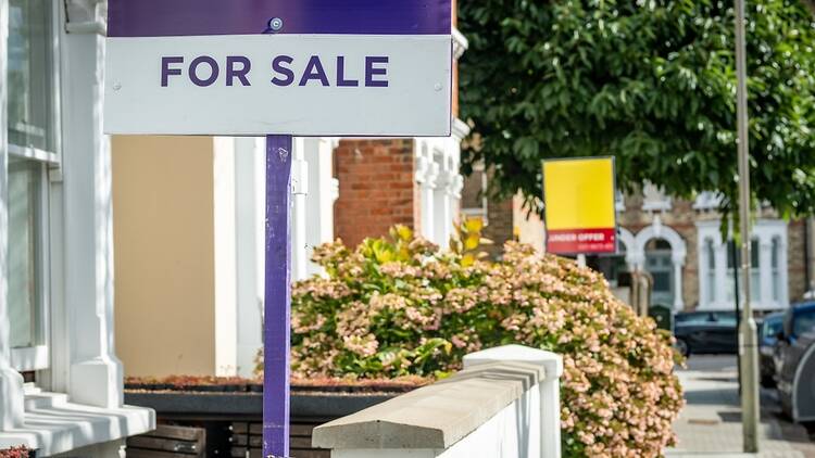 Estate agent signs in the UK