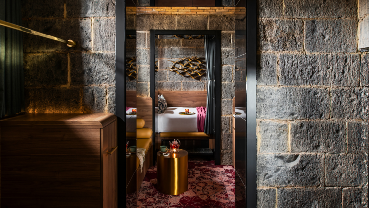 A hotel room made from five jail cells