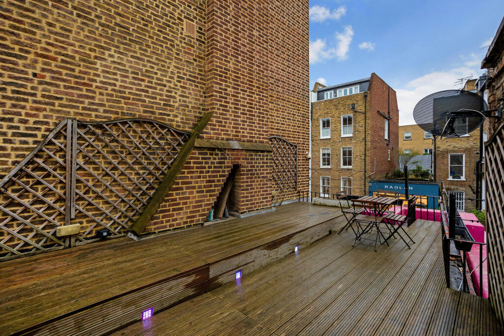 Photograph of a wooden terrace atop a house