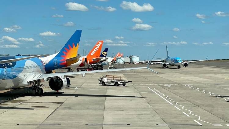 Planes on a runway with easyJet, Ryanair and Jet2