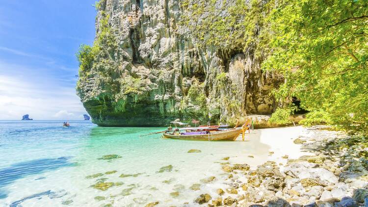 Boat docked on sand island