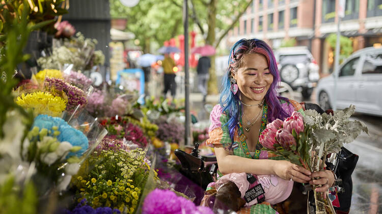 A woman buying flowers