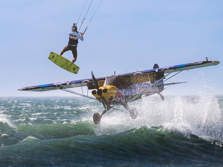 Kitesurfer jumps plane off Cape Town in world-first stunt!