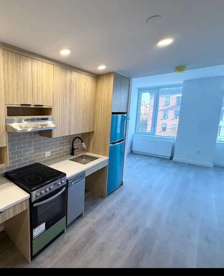 the kitchen and living room at the Douglass Street affordable apartment lottery