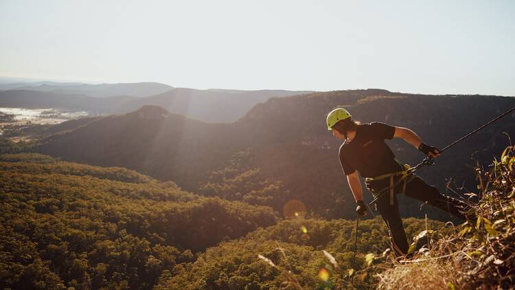 Man abseiling in national park