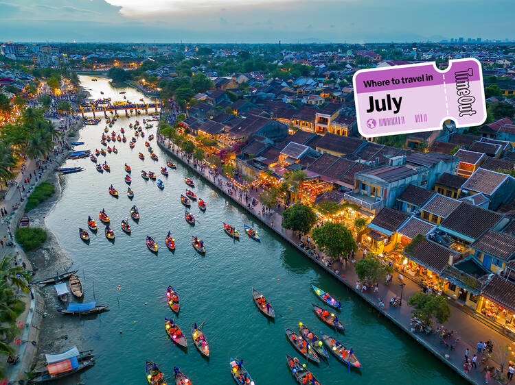 Where to travel in July asset showing boats on the river in Hoi An, Vietnam