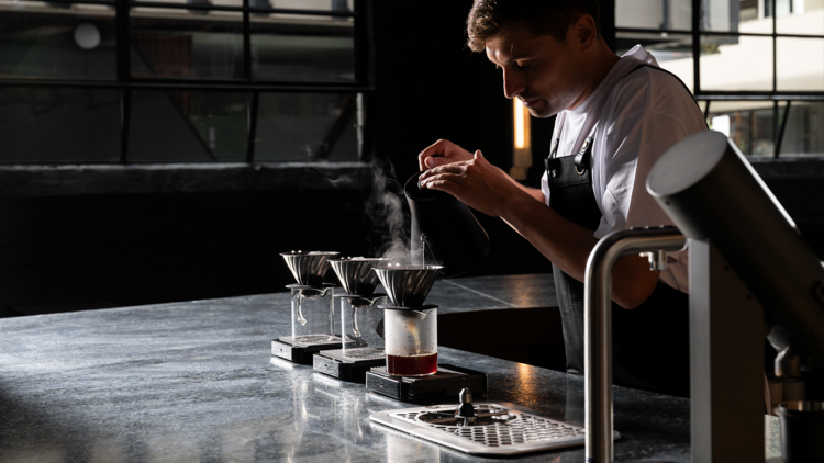 A man pouring coffee