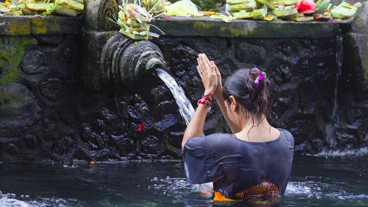 Partake in water blessings in Bali