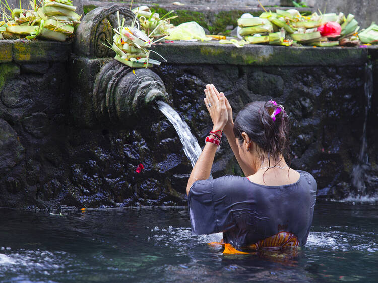 Partake in water blessings in Bali