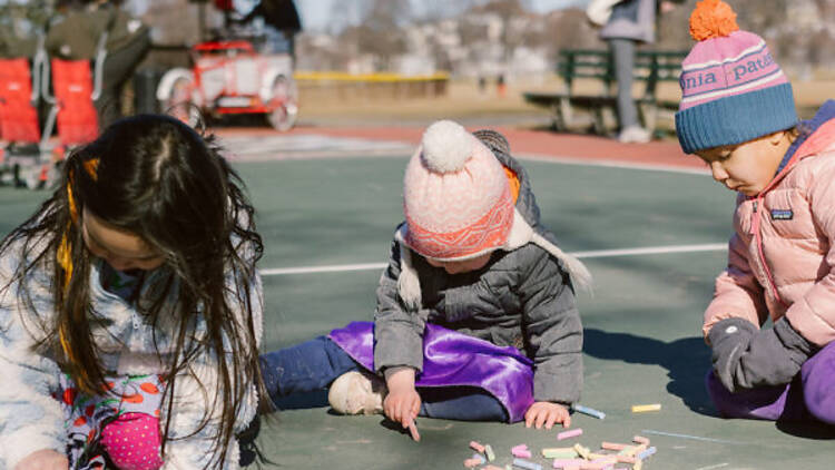 Kids drawing on sidewalk with chalk Kids drawing on sidewalk with chalk