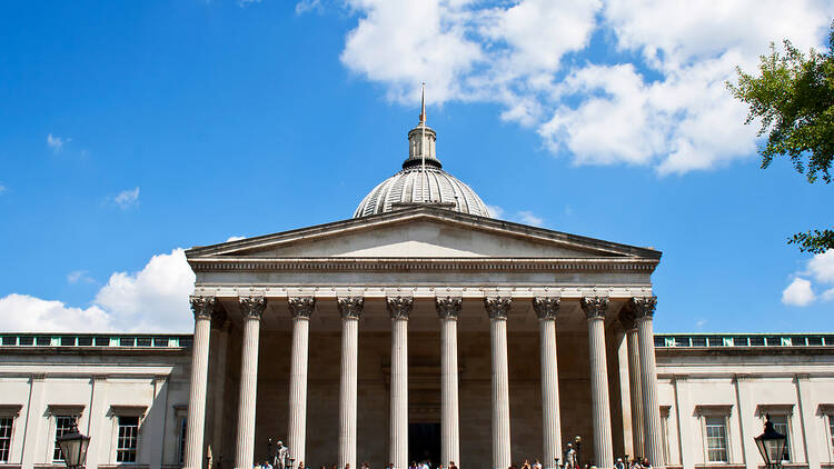 University College London on a sunny day with people relaxing on steps outside