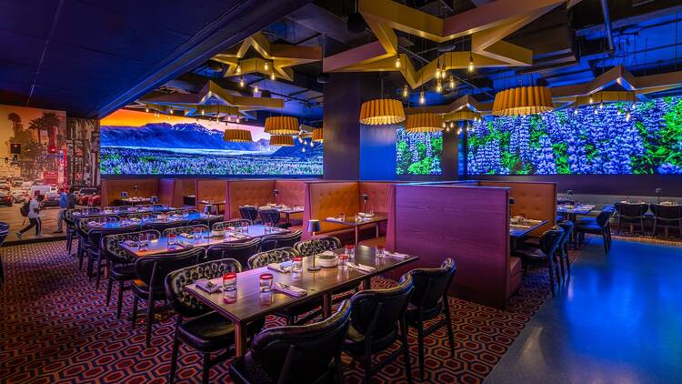 Purple lit neon dining room with large stars on the ceiling