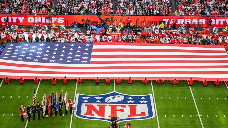 Aerial shot of the American flag is displayed on the field ahead of Super Bowl LVII between the Kansas City Chiefs and the Philadelphia Eagles