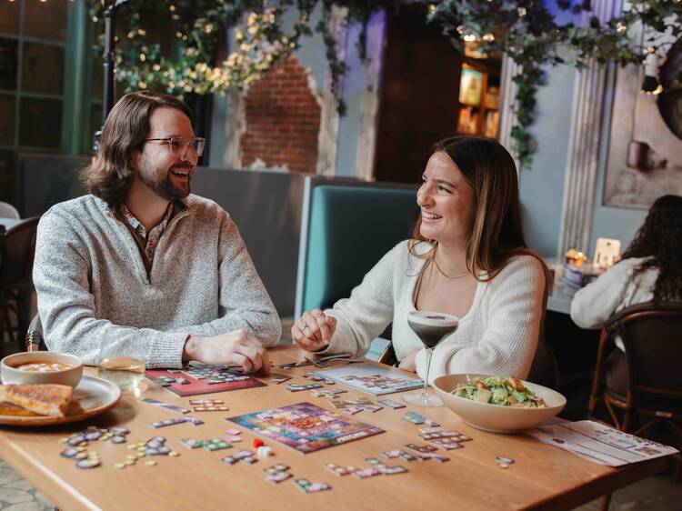 two people playing a board game