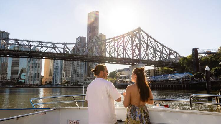 Couple on City Cat approaching Story Bridge 