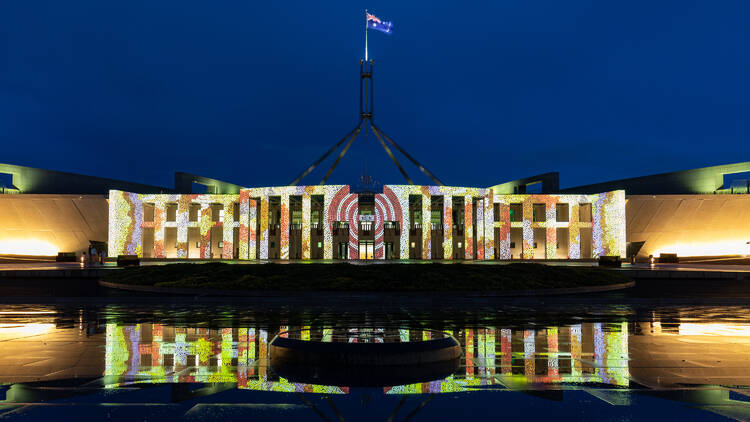 Parliament House illuminated with lights at night