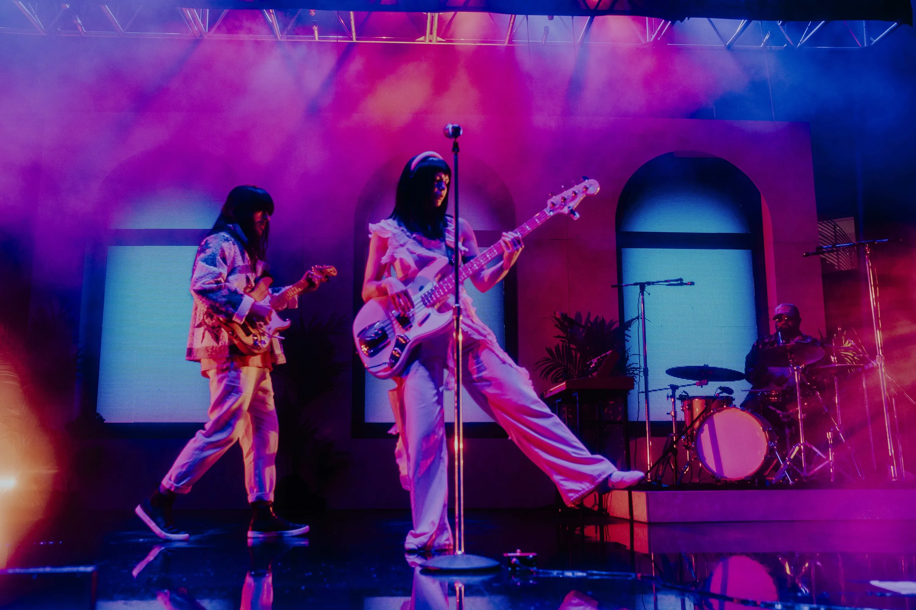 Khruangbin performing on stage.