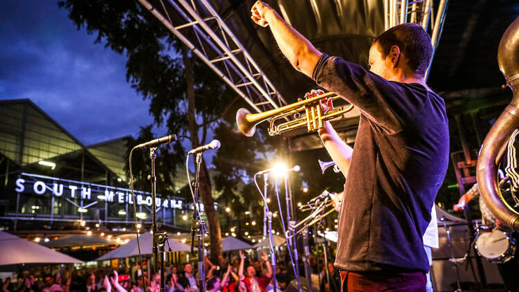 A jazz band playing on stage at the South Melbourne Market.