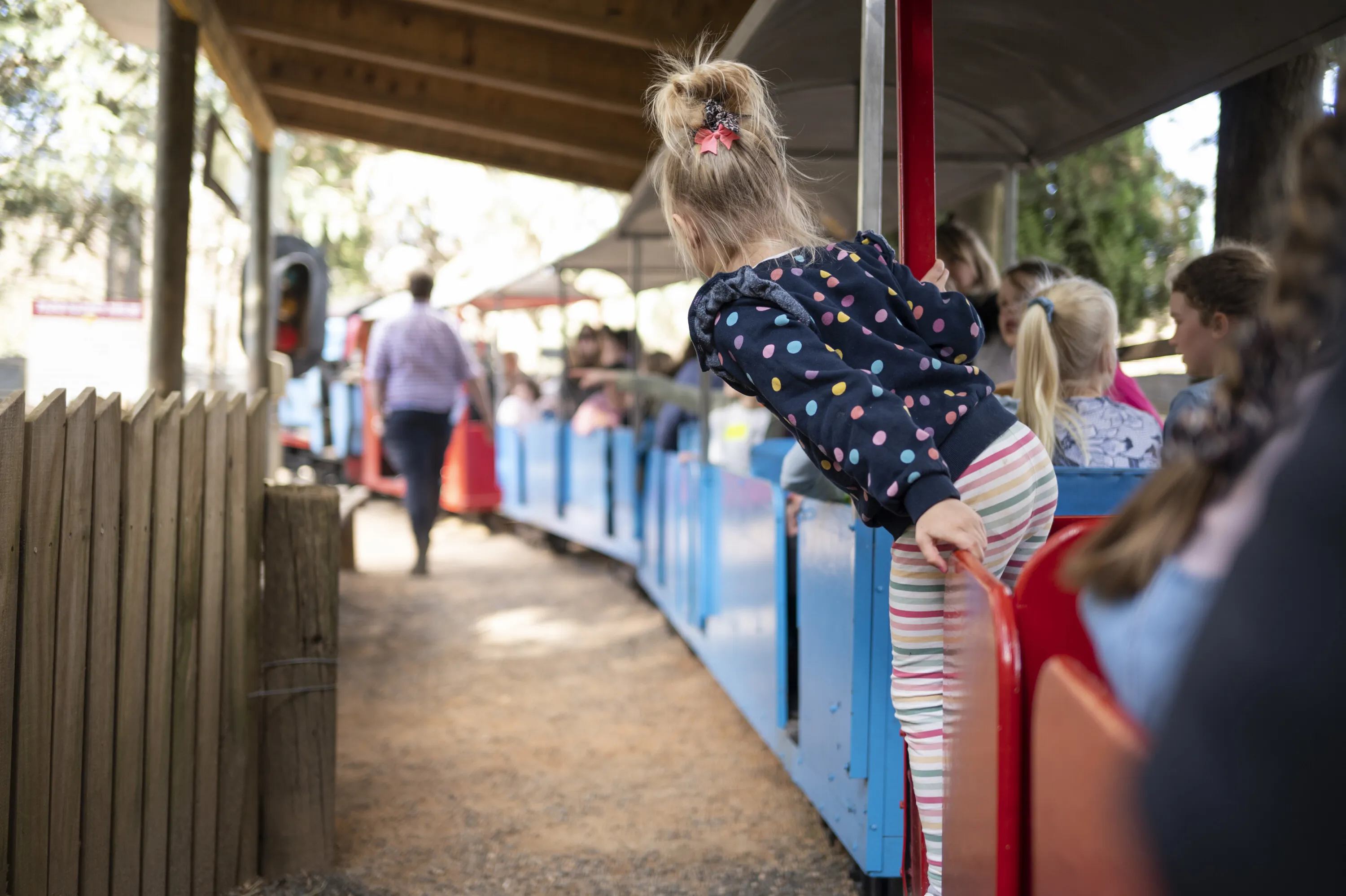 Kids riding miniature train