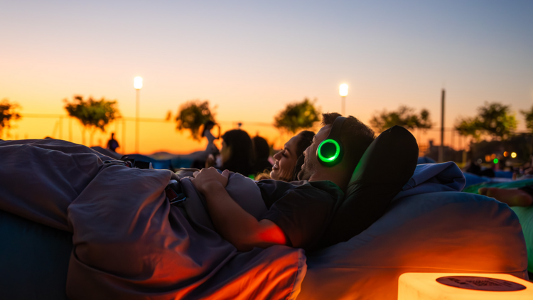 a couple at an outdoor cinema