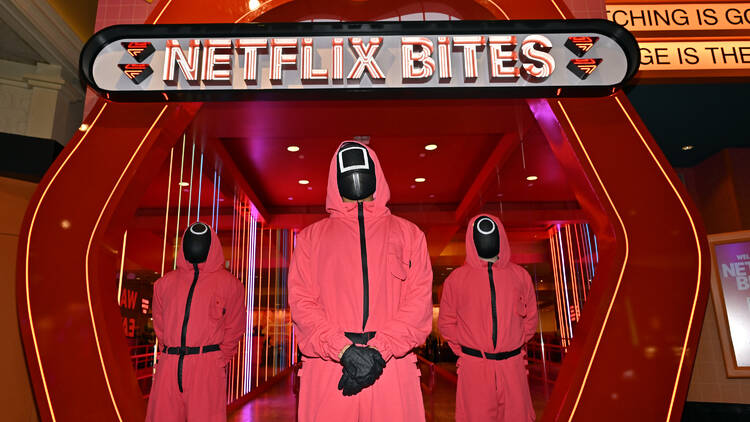 Squid Game characters are seen during Netflix BITES Vegas press preview event on February 10, 2025 in Las Vegas, Nevada. (Photo by David Becker/Getty Images for Netflix)