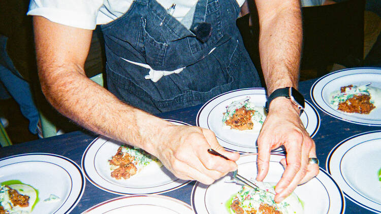 A chef plating a dish