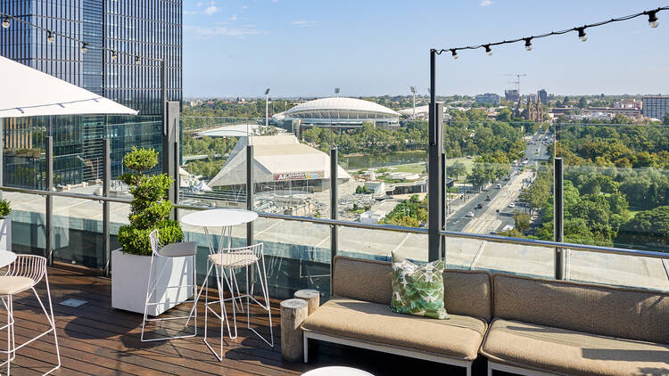 Rooftop bar with garden and city views