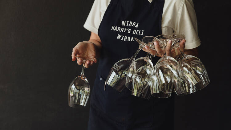 Waiter holding wine glasses