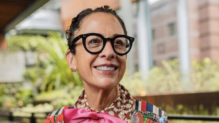 Nancy Silverton in an orage blouse with a pink bow