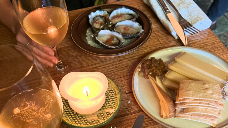 Spread with cheese, oysters and wine