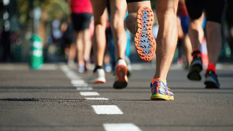 A group of runners on a road 