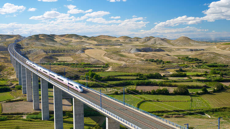 A high-speed train on a viaduct in Spain