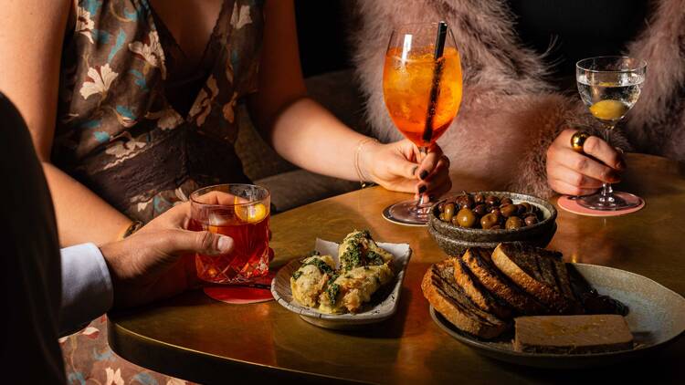 Snacks and cocktails on table