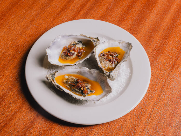 Grilled oysters with spiced lamb fat