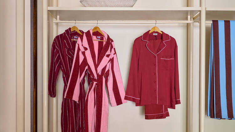 Colourful robes and pajamas hanging up. 