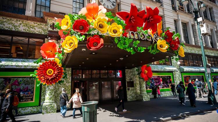 Macy's flagship department store in Herald Square in New York festooned with floral arrangements for the 2024  Macy's Flower Show, in partnership with Dior