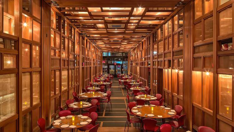 Wooden interior with round tables and chairs